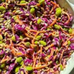 crunchy red cabbage and edamame salad with citrus tahini dressing