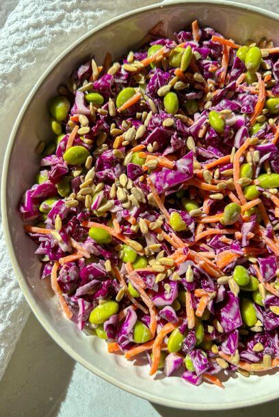 crunchy red cabbage and edamame salad with citrus tahini dressing 